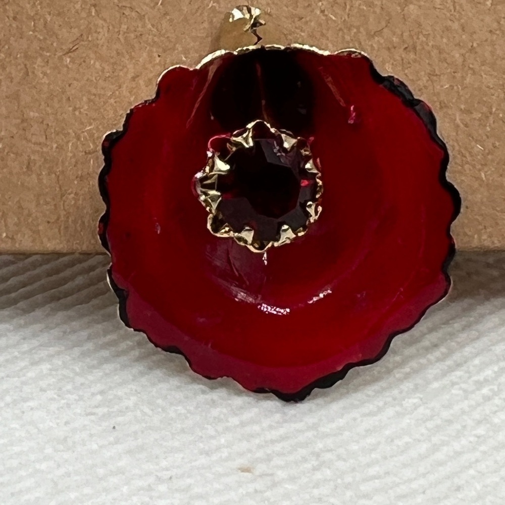 Vintage Francois ruby enamel and gold tone single clip on earring.
